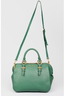 Green bag with golden fittings