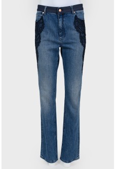 Jeans with lace inserts and tag
