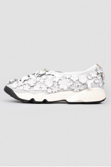 Sneakers with floral appliqués in leather
