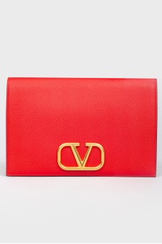 Clutch on a magnet of red leather