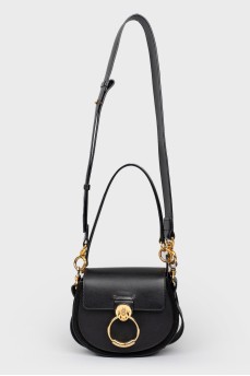 A handbag with a long Tess handle