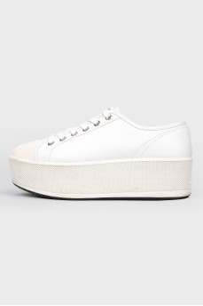 White sneakers on thick sole