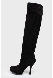 Black suede boots with stiletto heels