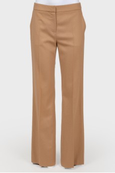 Brown trousers of straight cut from a camel wool
