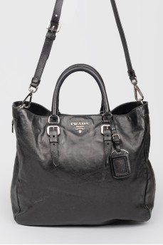 Black leather bag on pens and shoulder belt