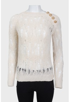 Knitted openwork sweater with golden buttons