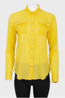 Yellow shirt with golden buttons