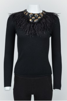 Black jumper with feathers and leather figures