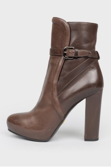 Leather brown boots with a strap
