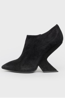 Black suede boots with curved heels