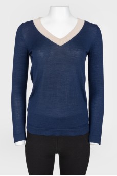 Dark blue longshit with a beige strip on the neck
