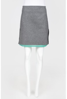 Gray woolen skirt on a green lining