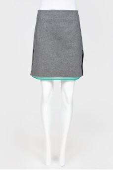 Gray woolen skirt on a green lining