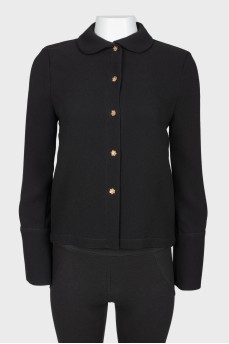Black blouse with golden buttons in the form of flowers