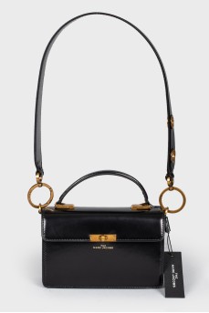 Little leather black handbag with tag