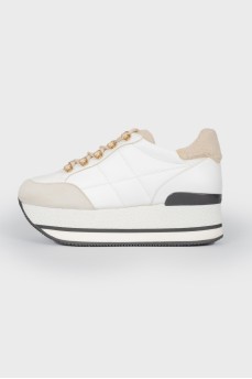 White leather sneakers on a high platform