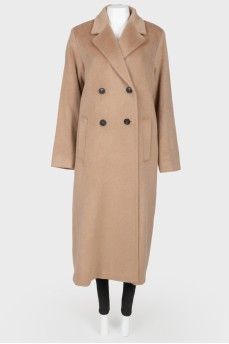 A woolen long coat with a tag