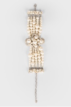 Pearl bracelet with a cross