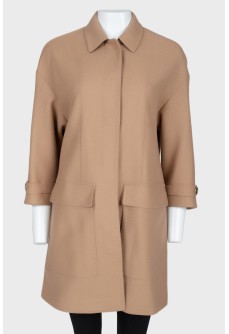 Light brown coat with gold buttons