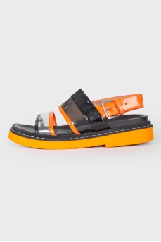 Black and orange sandals with a strap
