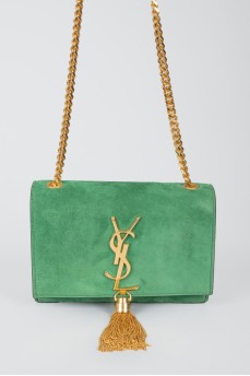 Green sued handbag with golden fittings, on the button