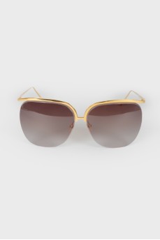 Brown glasses with a golden arc