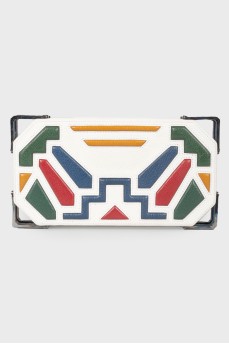 Clutch with a geometric pattern and metal edges