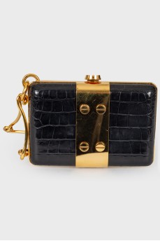 Black leather and gold metal clutch bag