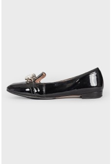 Black patent leather loafers embellished with rhinestones