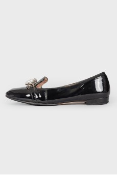 Black patent leather loafers embellished with rhinestones
