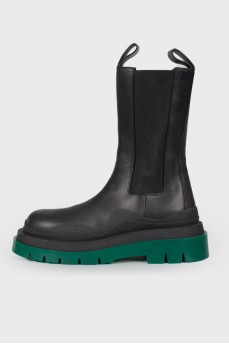 Leather boots with green rubber sole