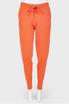 Coral cashmere trousers with tag