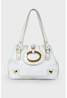 White bag with golden ring