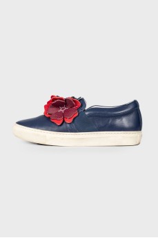 Leather slip-ons with floral appliqué