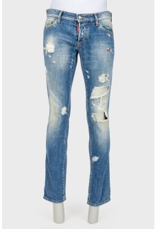 Male jeans with the effect of torn and shabby