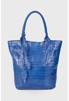 Blue bag with feather accessory