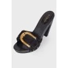 Sandals with a textured golden buckle