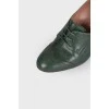 Green ankle boots with perforation