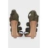 Suede sandals with wooden heels.
