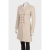 Fitted coat with indentations