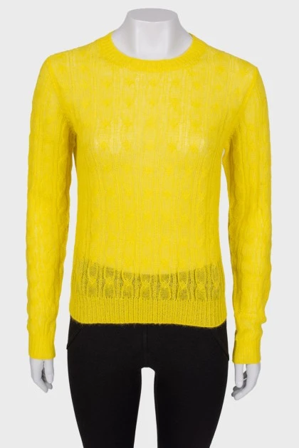 Translucent yellow sweater with a tag