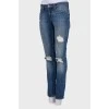Jeans with decorative slots