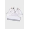 White sneakers with tag