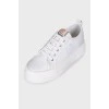 White sneakers with tag