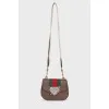 Bag with appliqué and wide strap