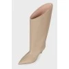 Pointed heel leather boots with tag