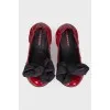 Lacquered ballerinas with a large bow