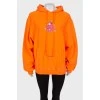 Orange hoodie with print