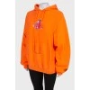 Orange hoodie with print
