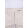 Compressed beige pants with arrows